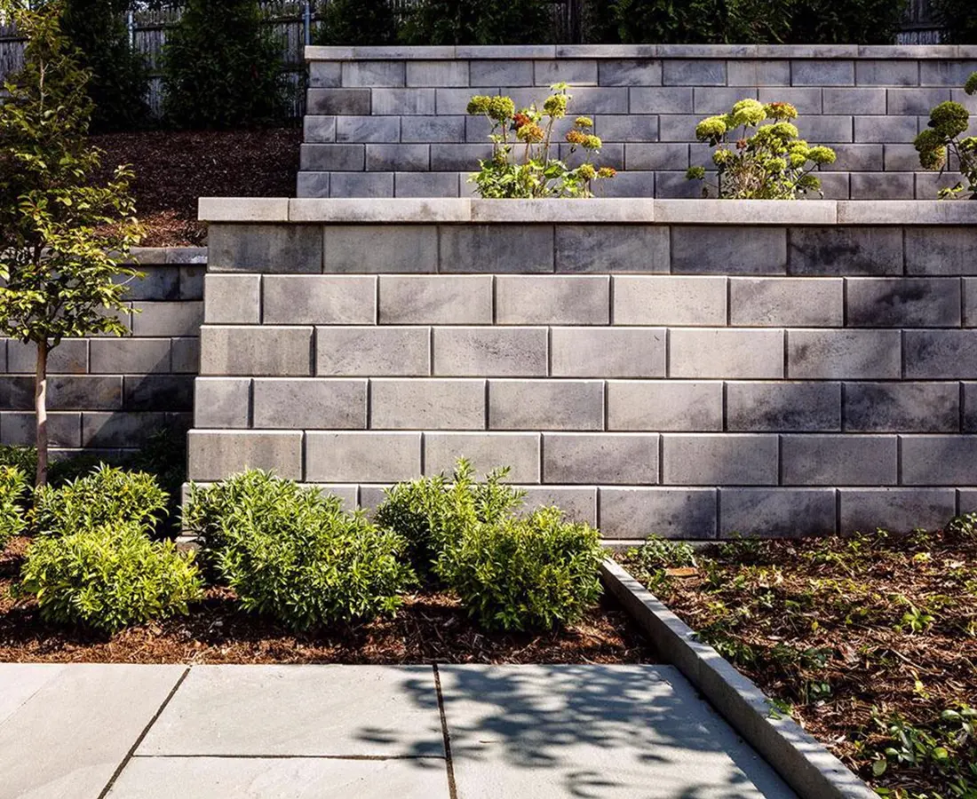 Retaining WallsSee our retaining walls and feel a sense of pride. Beyond their strength, they add an aesthetic charm to your landscape, blending form and function beautifully.